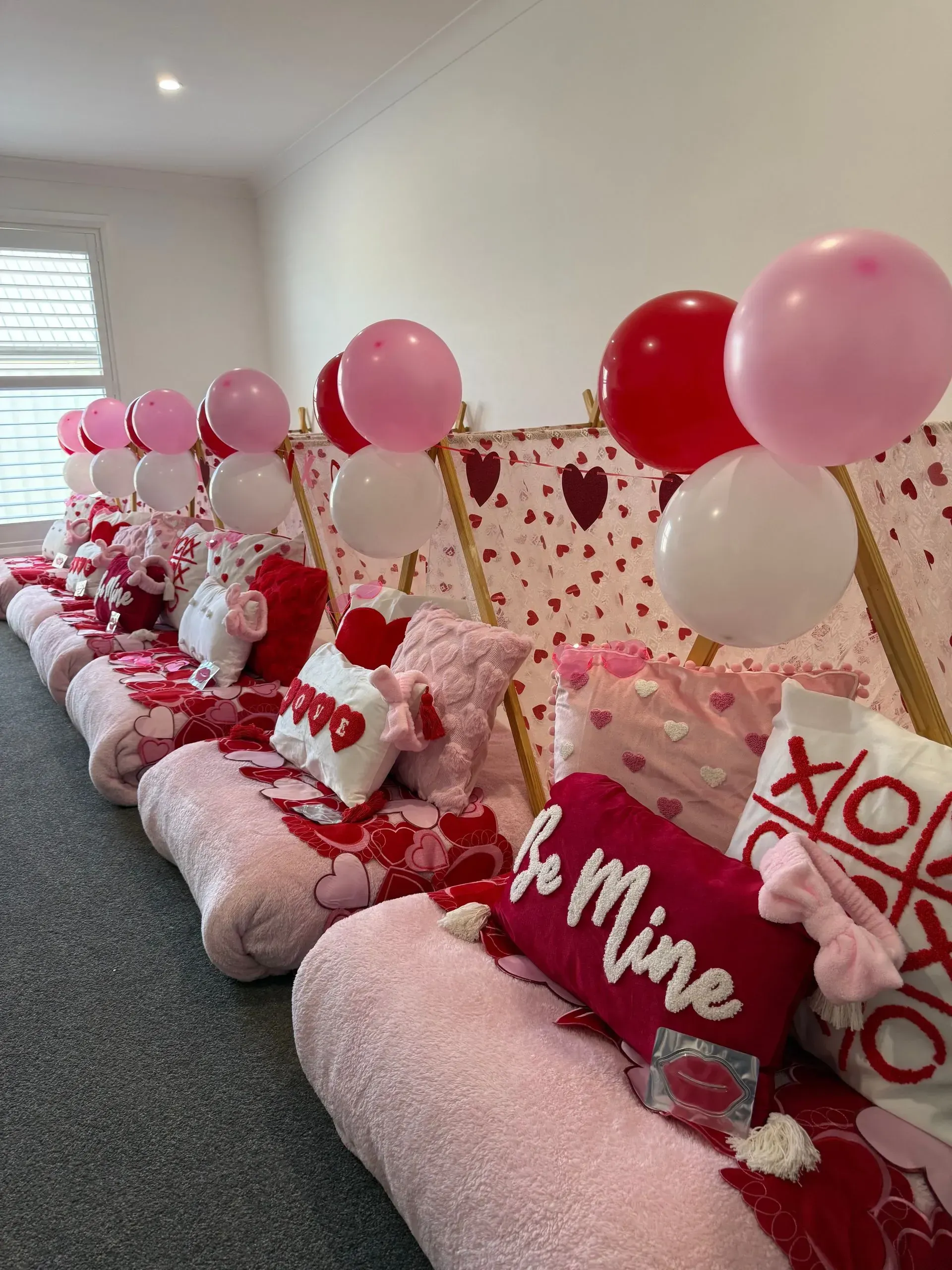 Pink Decorated Couches With Heart Pillows and Balloons — Sweet Parties & Braids in Tatton, NSW