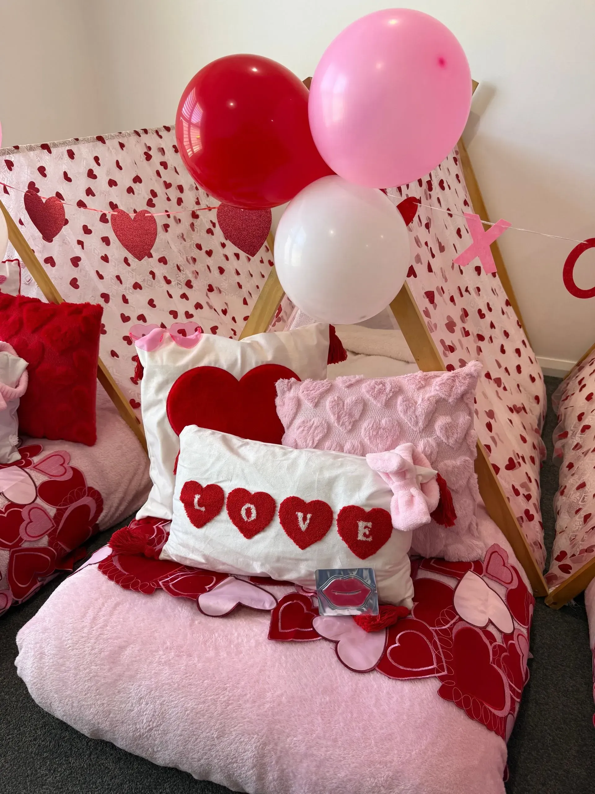 Pink Balloon-decorated Bed With Heart Pillows — Sweet Parties & Braids in Tatton, NSW