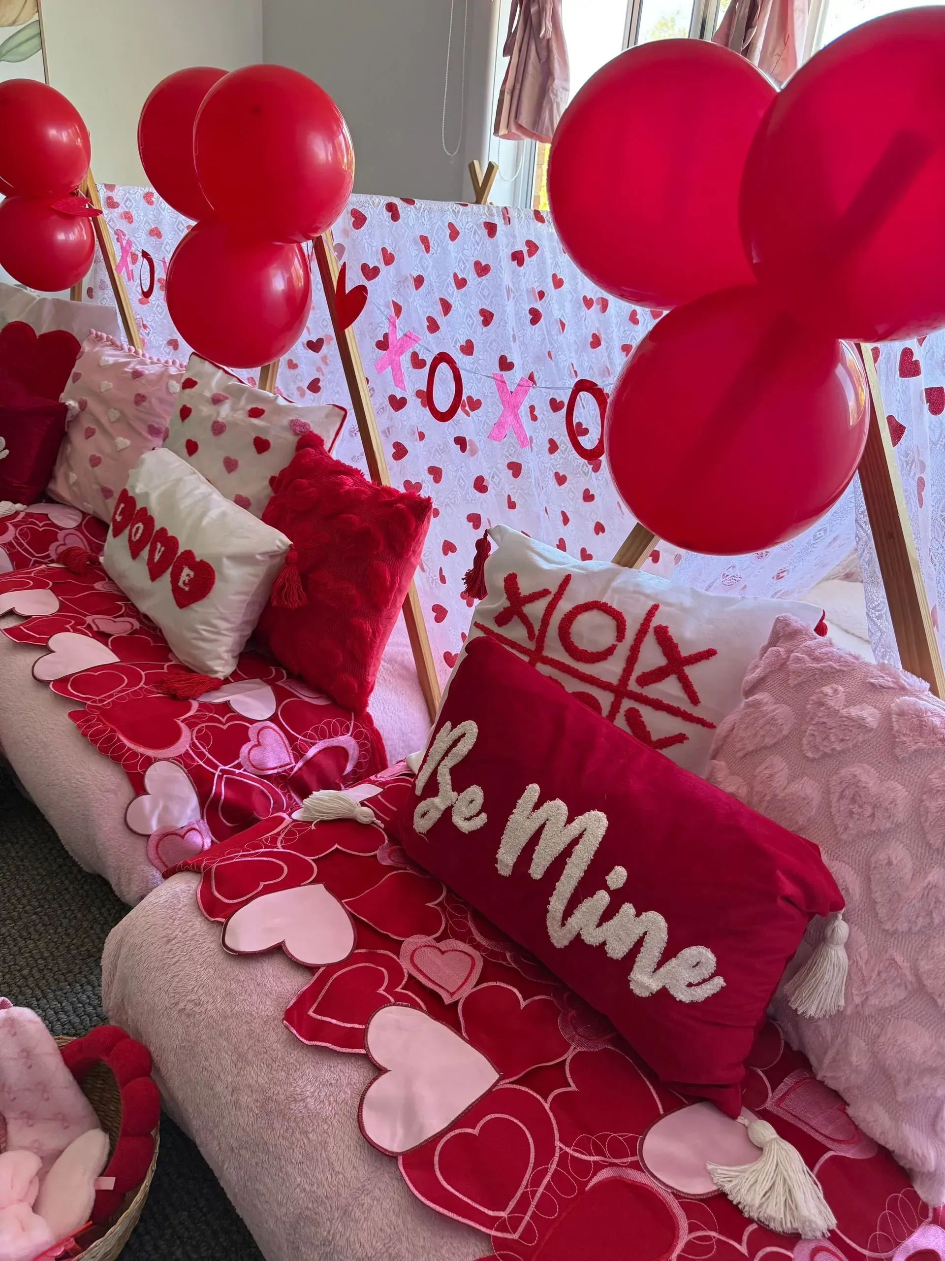 Red Valentine’s Day Couch Setup With Heart Pillows, Balloons — Sweet Parties & Braids in Tatton, NSW