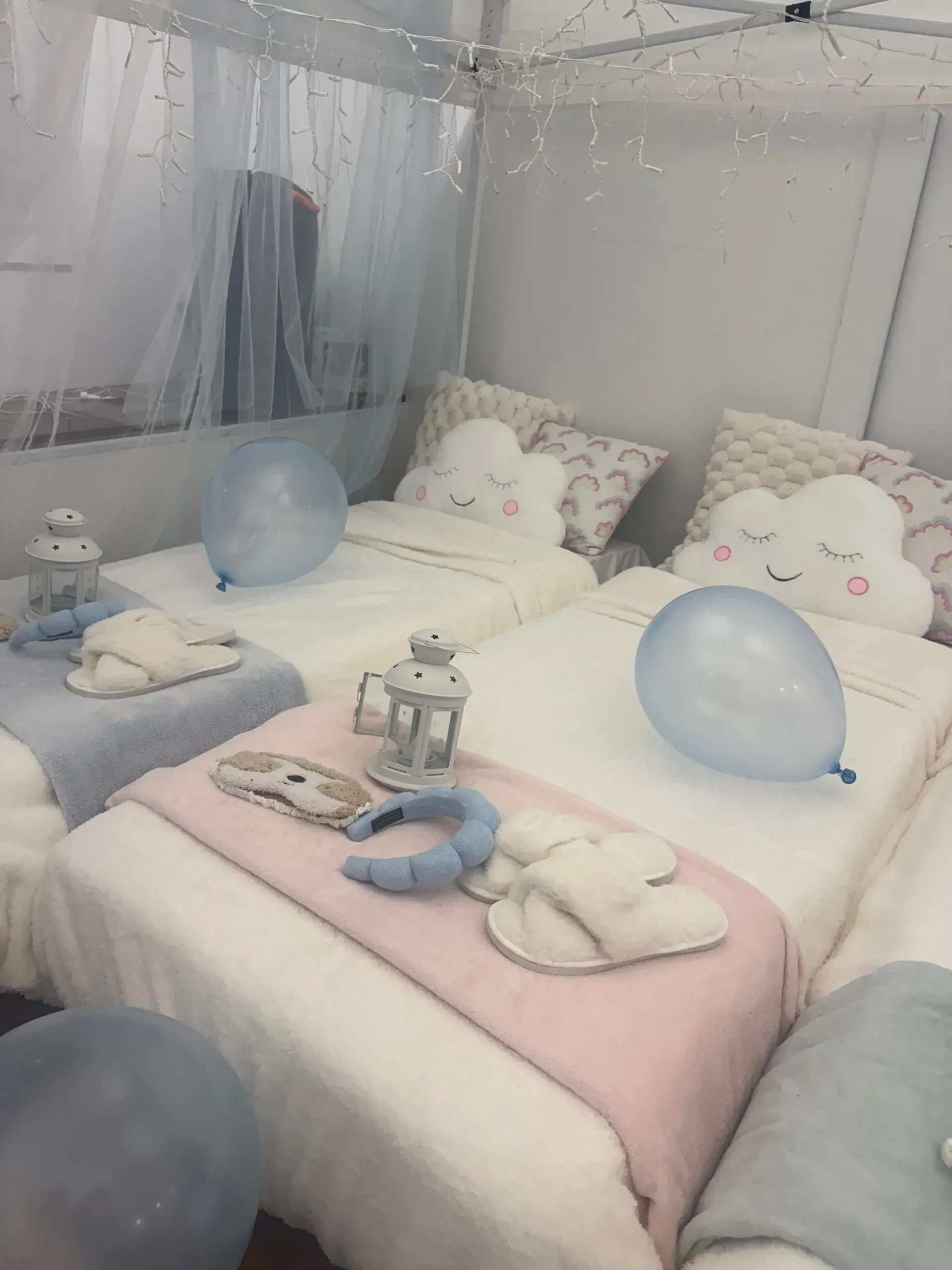 Cozy Bedroom With Pastel Bedding, Plush Pillows, and Blue Balloons — Sweet Parties & Braids in Tatton, NSW