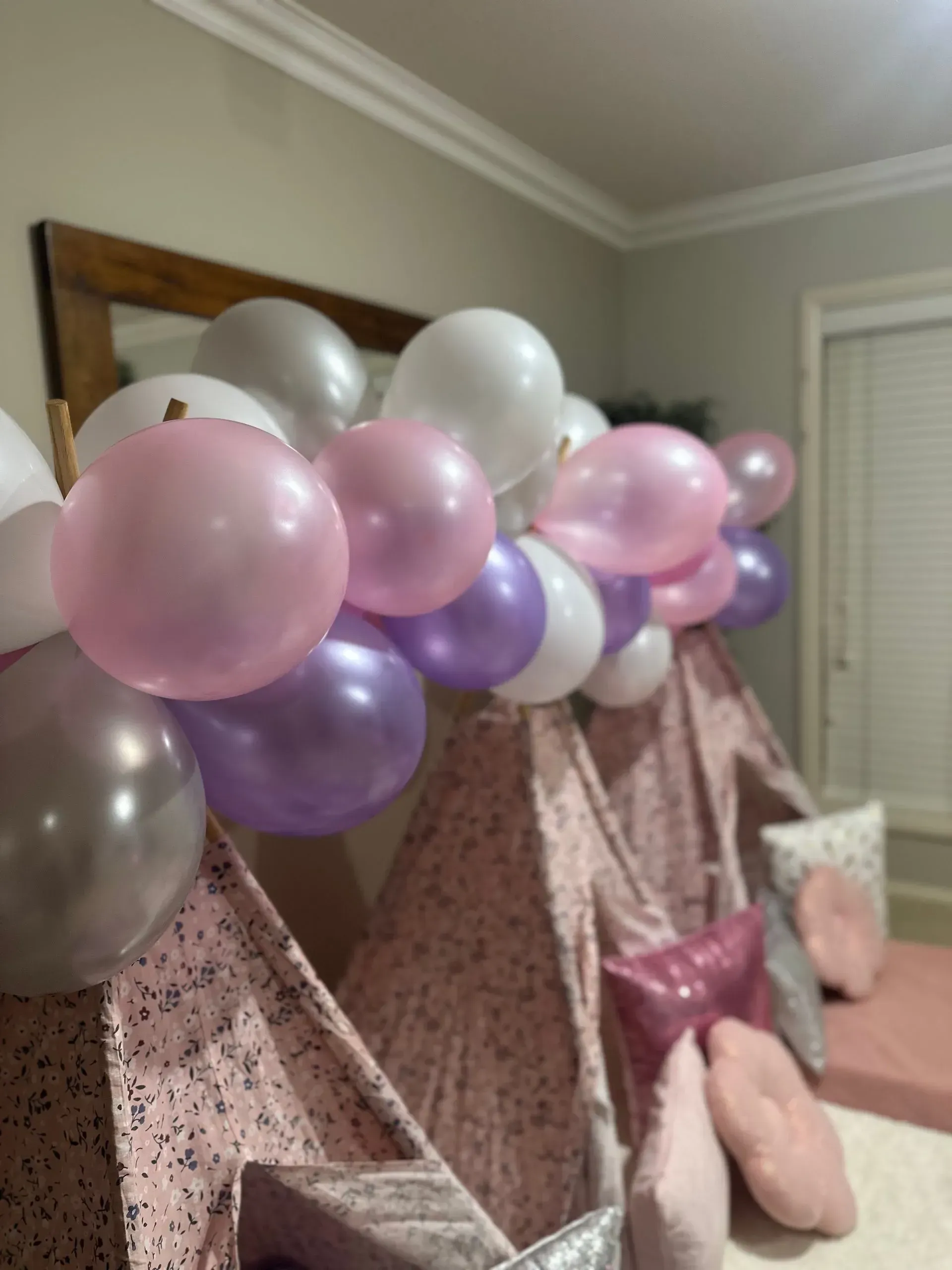 Balloon Garland of Pink, Purple, and Silver Over a Patterned Couch — Sweet Parties & Braids in Tatton, NSW