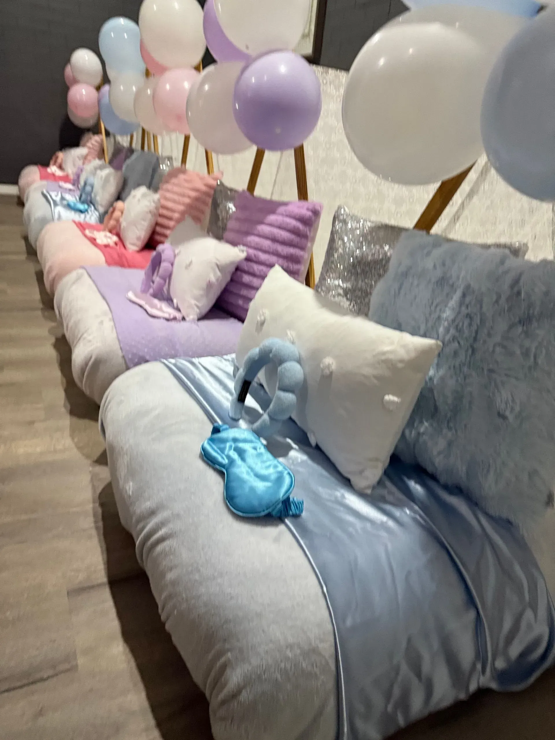 Balloon-decorated Lounge With a Row of Pastel Cushions — Sweet Parties & Braids in Tatton, NSW