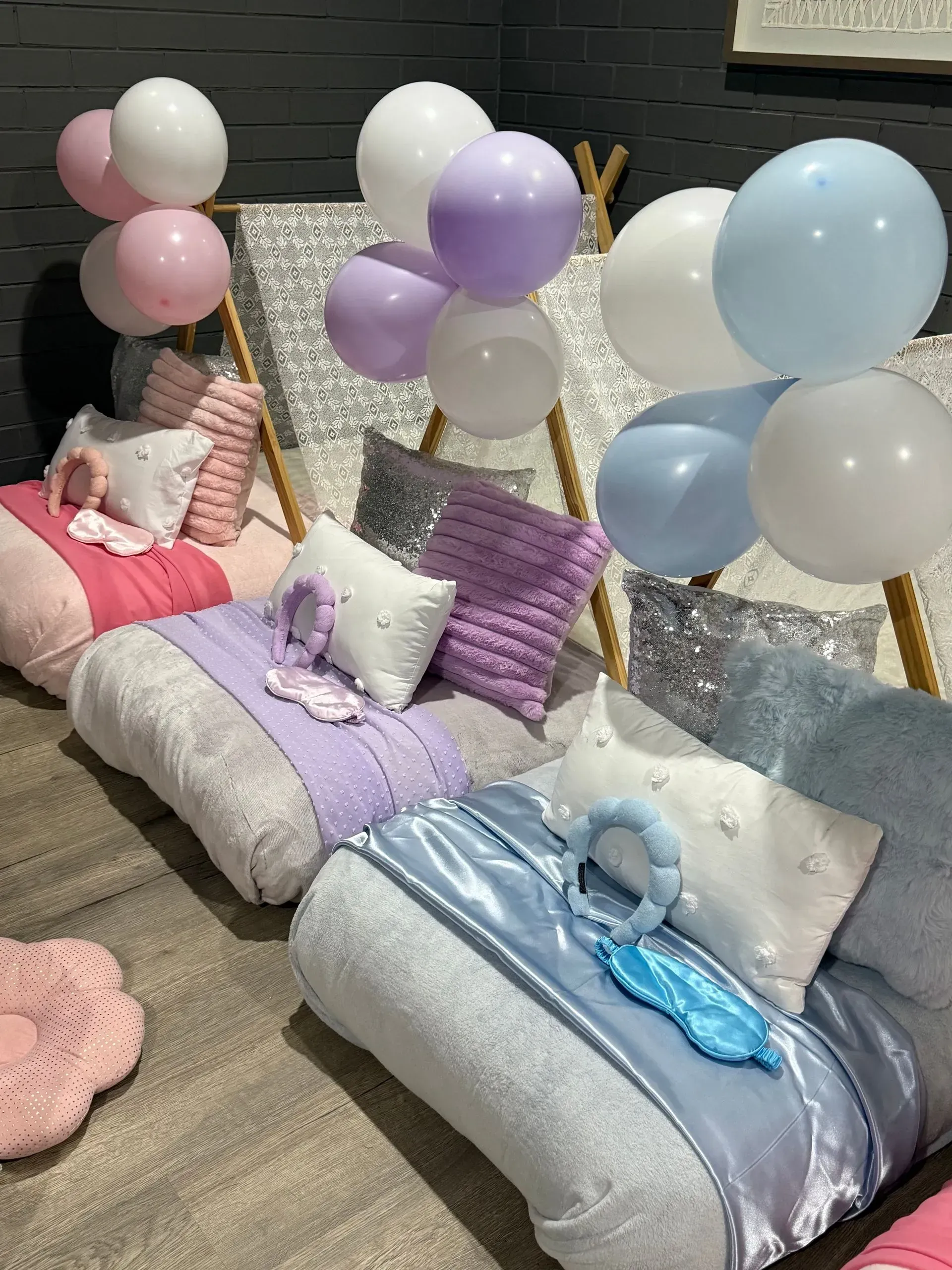 Pastel Balloons and Bedding Arranged Around Small Sleeping Mats — Sweet Parties & Braids in Tatton, NSW