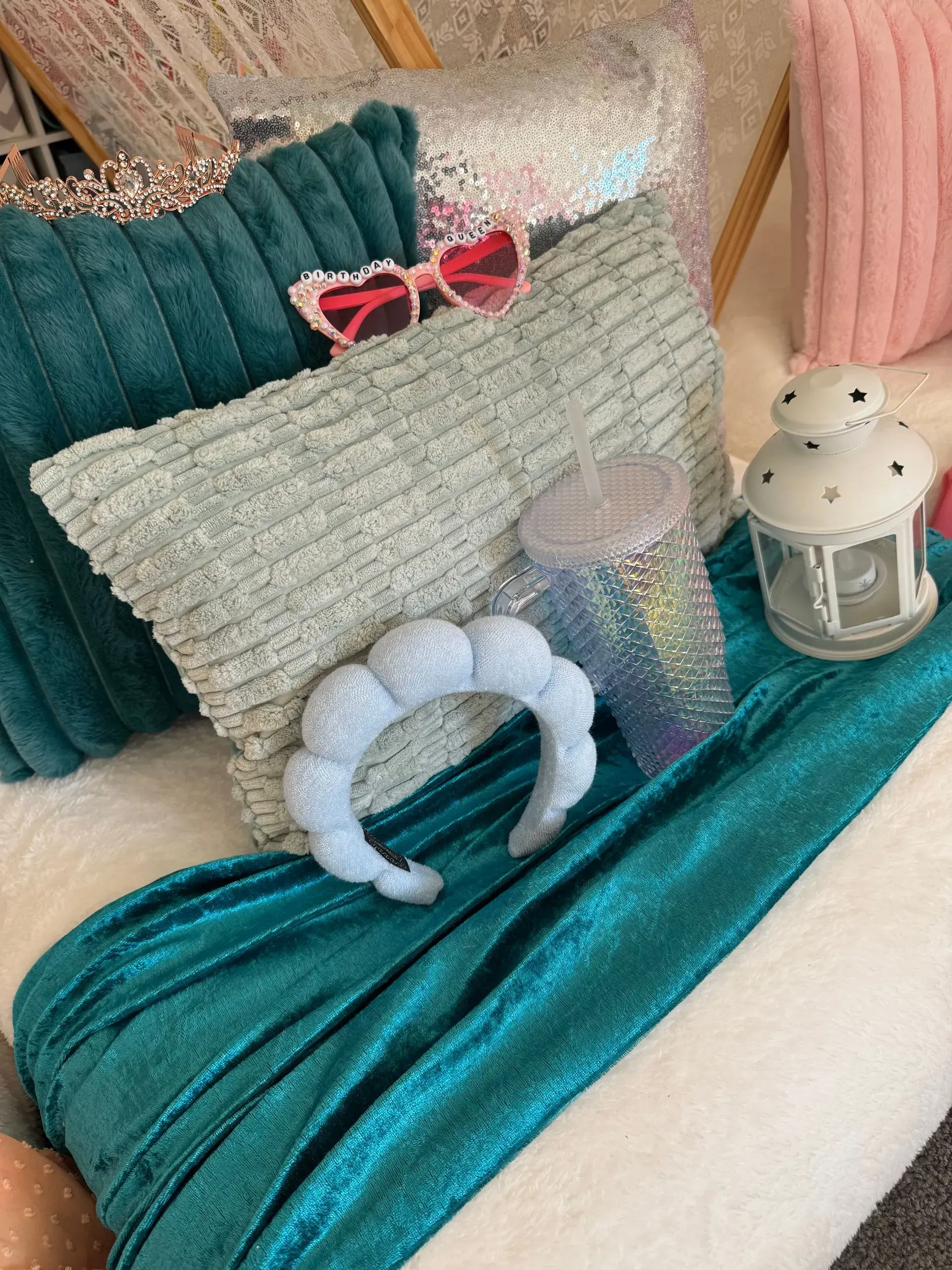 Teal and Silver Decorative Pillows and Blanket on a Bed — Sweet Parties & Braids in Tatton, NSW