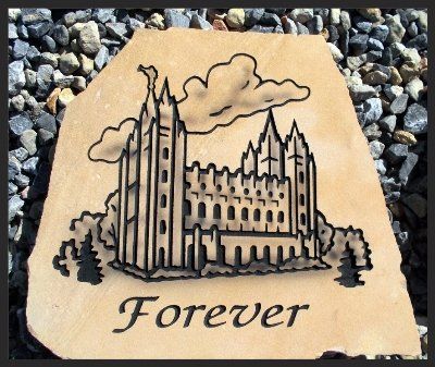 Etched temple with clouds and the word “Forever” on a tan stone plaque.