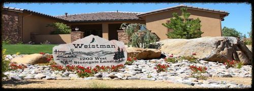Westmont sign in front of a tan building, with desert landscaping and rocks