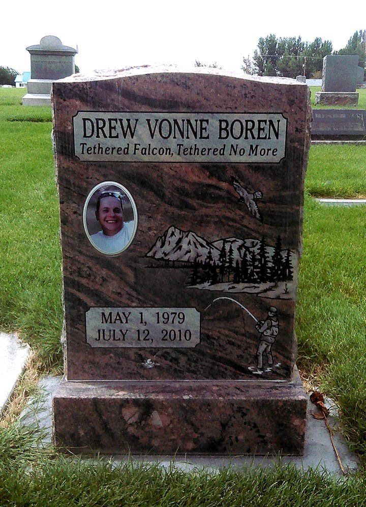 Gray granite grave marker in a cemetery for Drew Yvonne Boren, with a portrait and dates May 1, 1979–July 12, 2010.