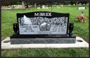 McBride family gravestone in a cemetery with black headstone and engraved portraits