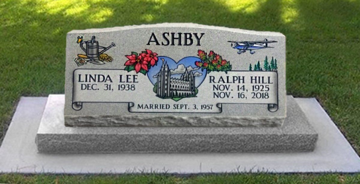 ASHBY gravestone with floral engraving and plaques for Linda Lee and Ralph Hill in a cemetery