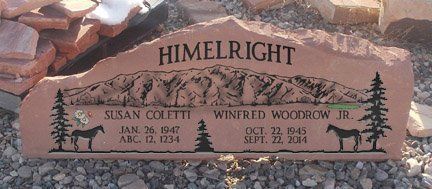 Himelright memorial plaque with names, dates, and deer carvings set in stone landscaping