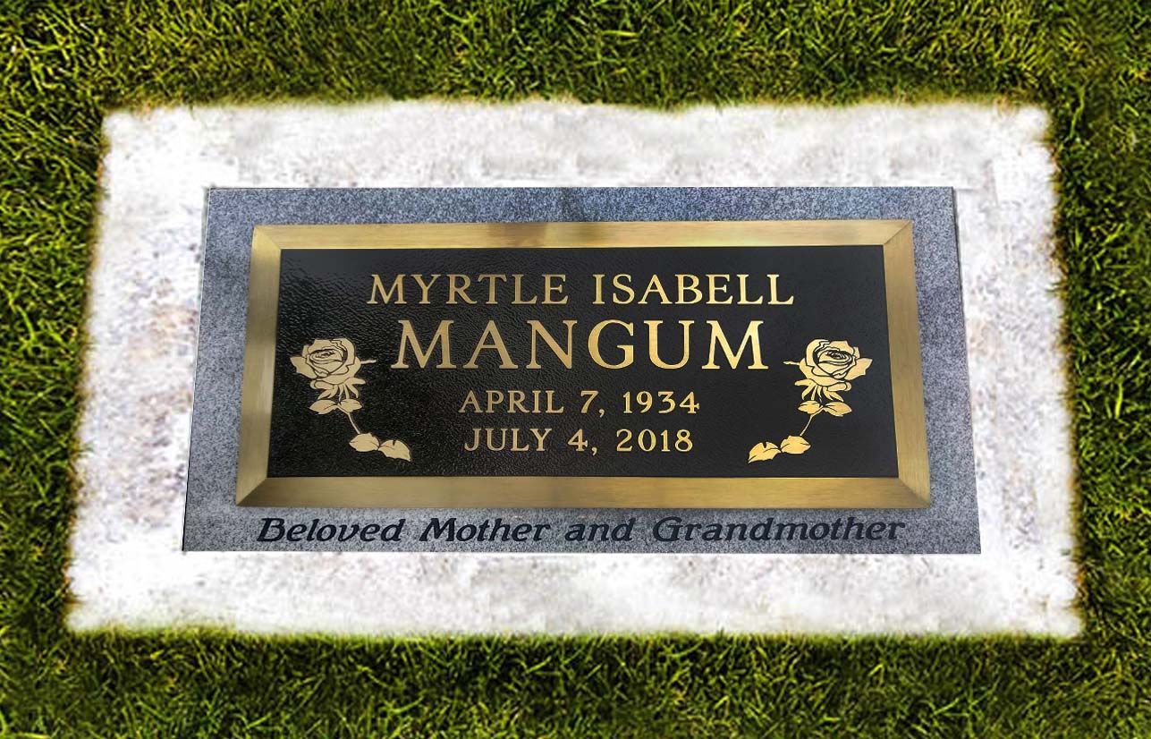 Gravestone plaque on grass reading “Myrtle Isabelle Mangum,” with dates April 7, 1934 and July 4, 2016