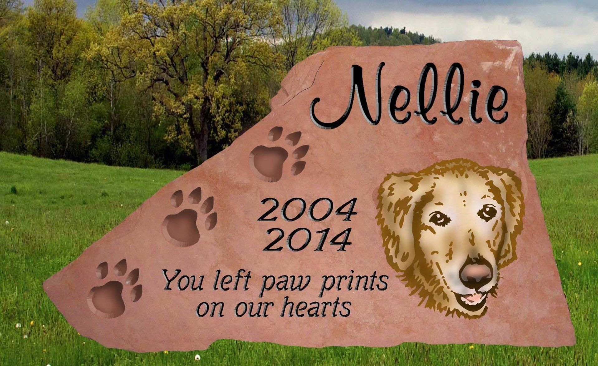 Pink memorial stone for Nellie, 2004–2014, with paw prints, dog portrait, and “You left paw prints on our hearts”