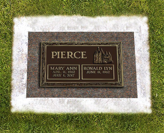 Gravestone plaque for Pierce on a grassy lawn, with names Mary Ann and Ronald Lynn engraved below.