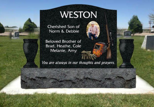 Black memorial gravestone with the name WESTON in a cemetery, honoring loved ones with a portrait and inscription.