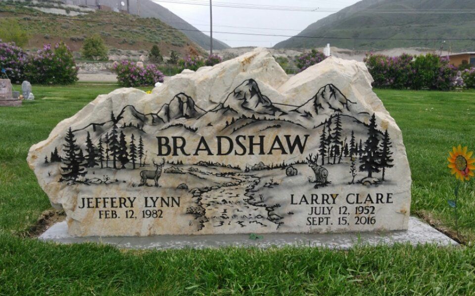 Memorial stone in a mountain cemetery engraved “Bradshaw,” with two names and dates