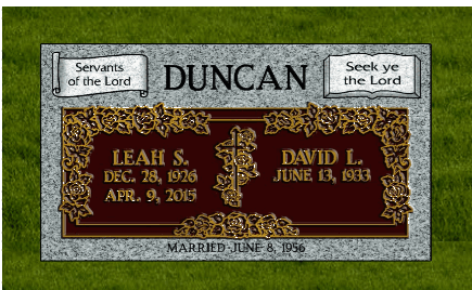 Memorial plaque for Duncan with Leah and David inscriptions on a gray stone background