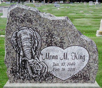 Gravestone with carved elephant and inscription “Mona M. King, Jan. 10, 1949 – Feb. 16, 2011”