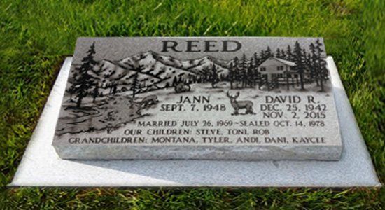 Reed family gravestone on grass, engraved with tree scene and memorial inscriptions