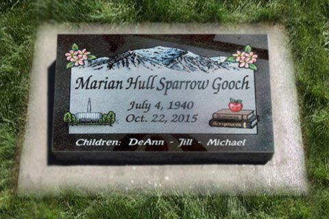 Gravestone for Marian Hall Sparrow Gooch with floral border and snow-covered mountain scene.
