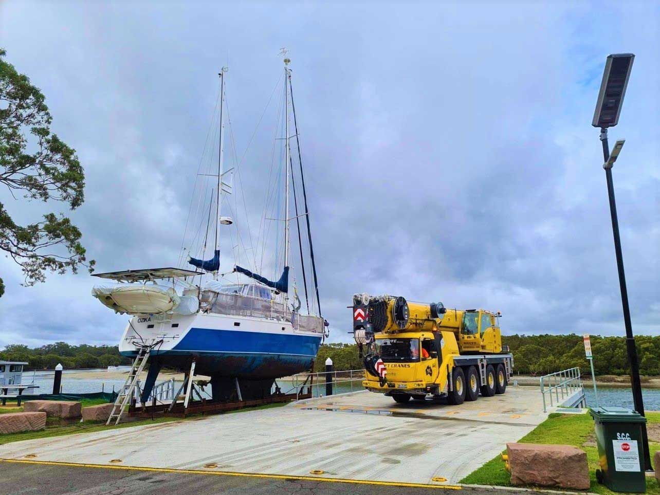 A Boat Is Being Lifted Into The Water By A Crane — All Lift Cranes In St Georges Basin, NSW