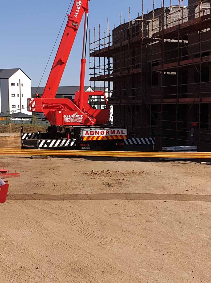 A Red Crane With The Word Adrumal On The Back — All Lift Cranes In Berry, NSW