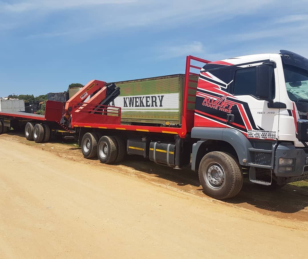 A Red And White Truck Is Parked On The Side Of A Dirt Road — All Lift Cranes In St Georges Basin, NSW