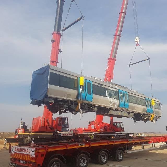 A Train Is Being Lifted Into The Air By A Crane — All Lift Cranes In Nowra, NSW