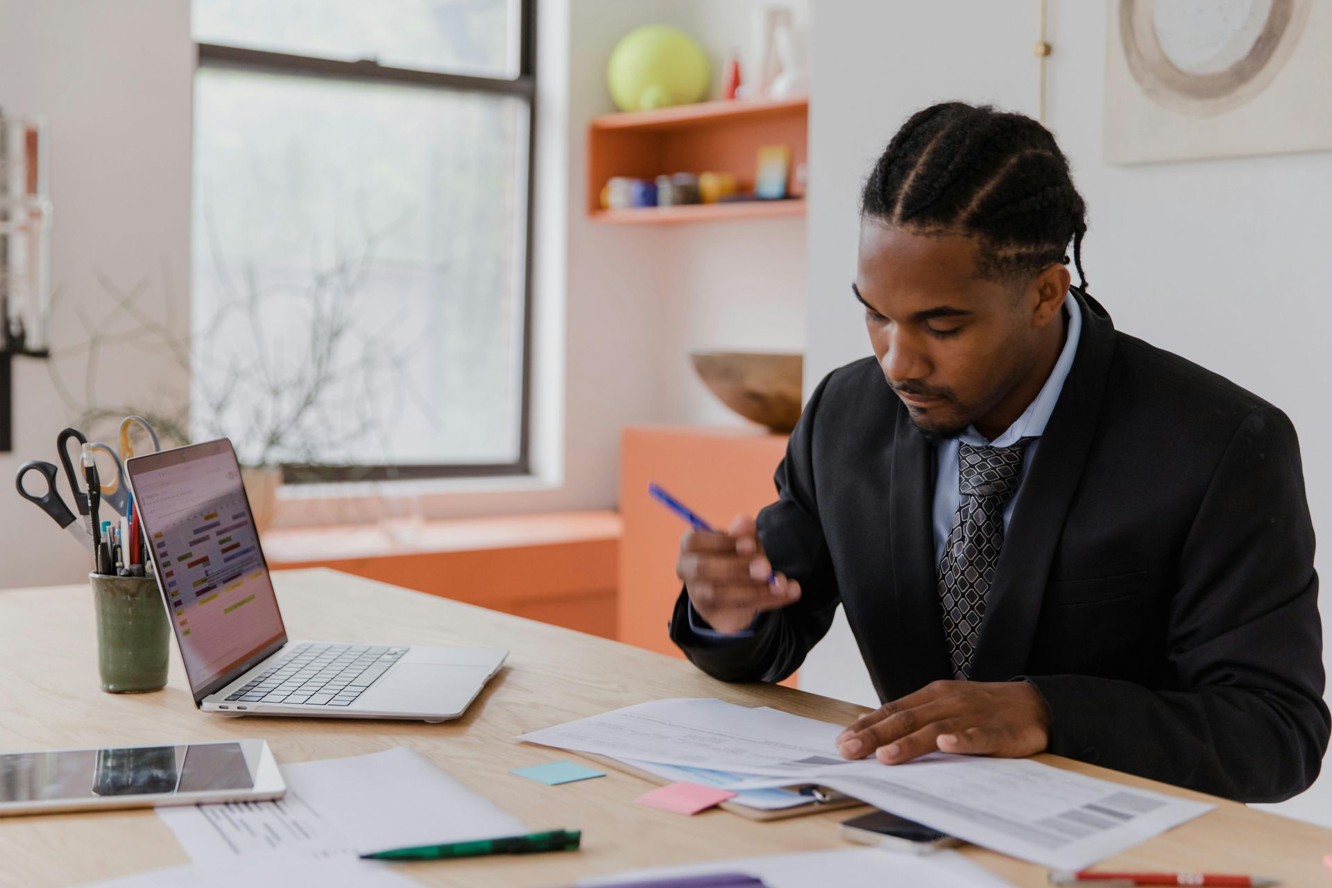 Business owner reviewing suspension documentation