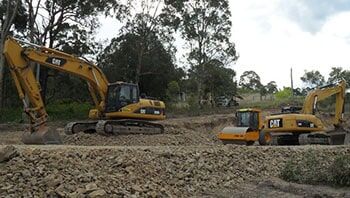 Two Excavators on a Construction Site — Elmac Plant Hire In Taree