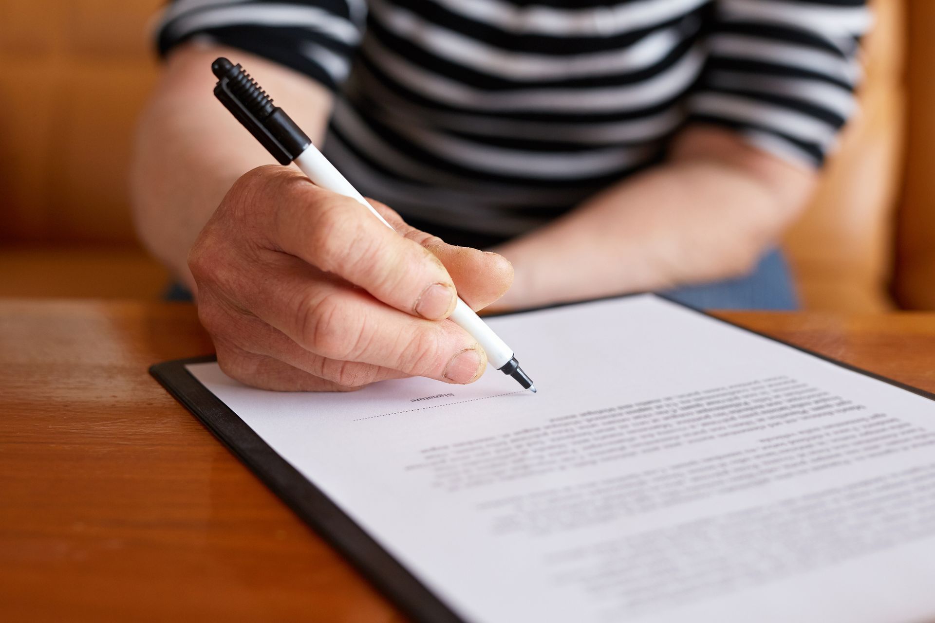 Woman signature document - Stayton, OR - Stayton Law