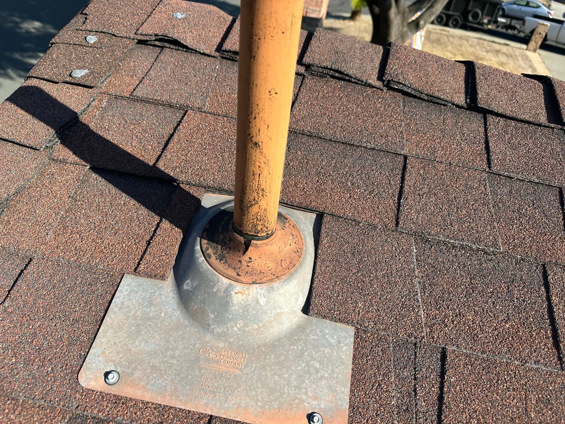 A pipe is sitting on top of a roof.