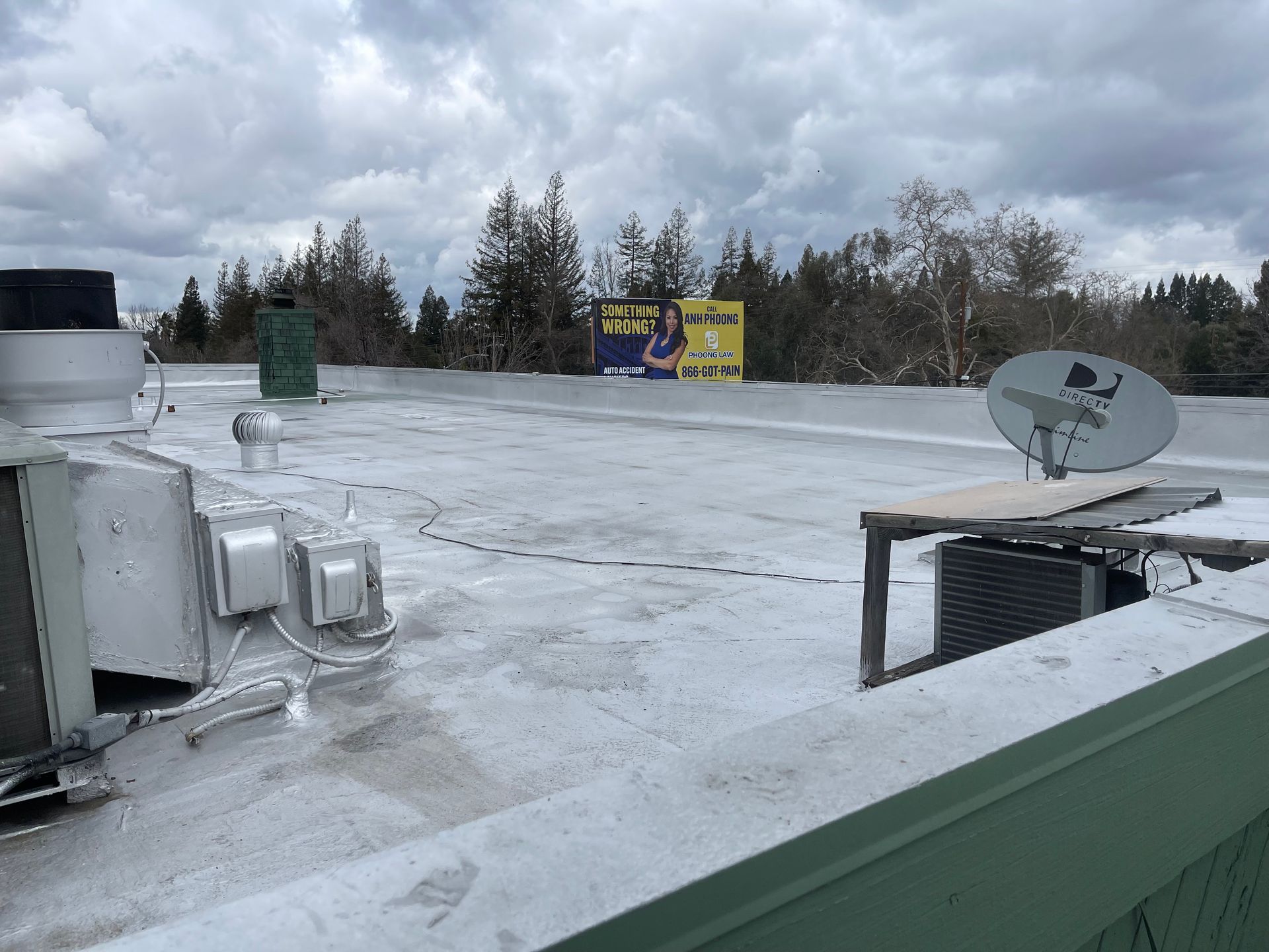 There is a satellite dish on the roof of a building.