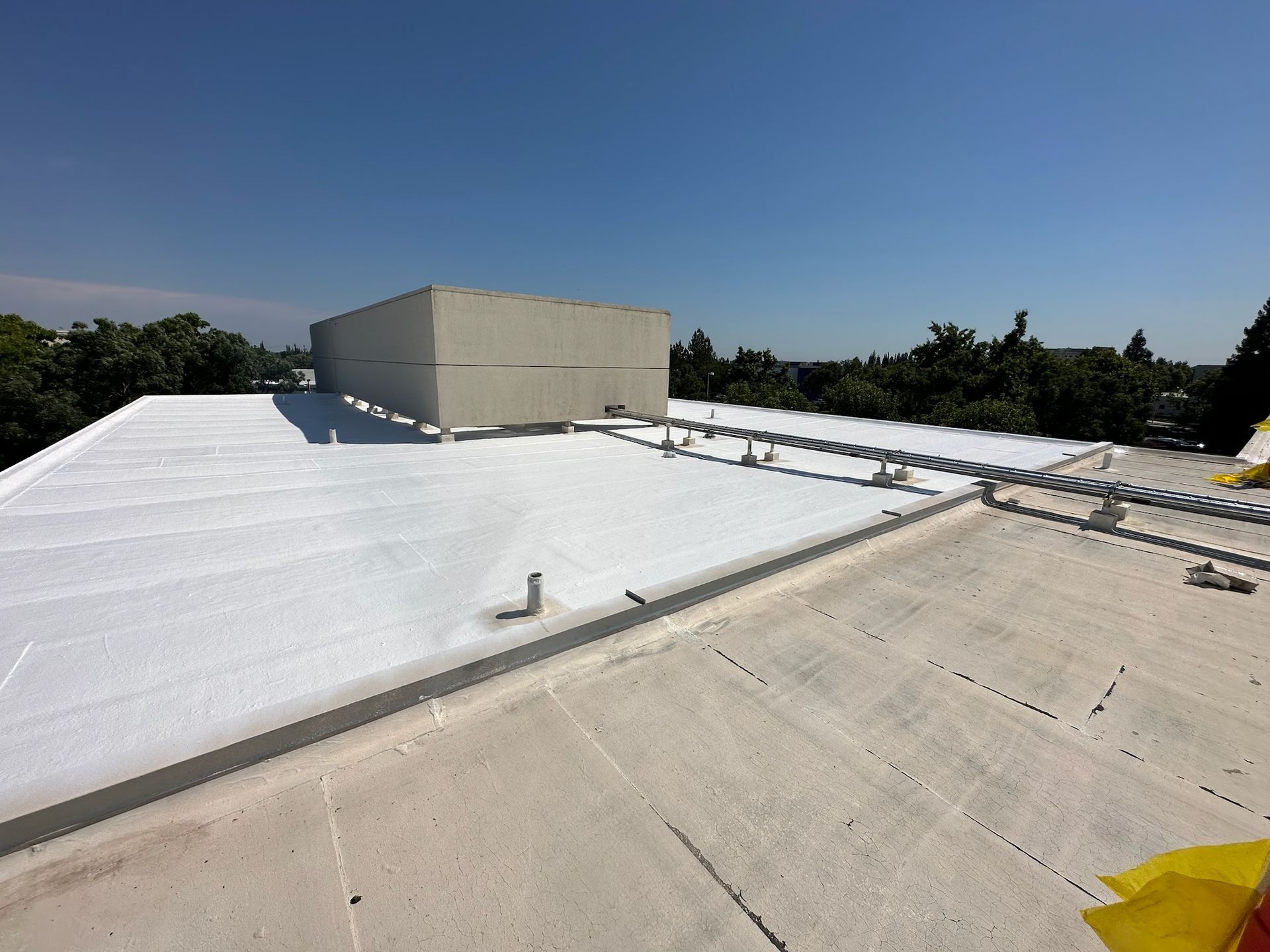 The roof of a building has been painted white