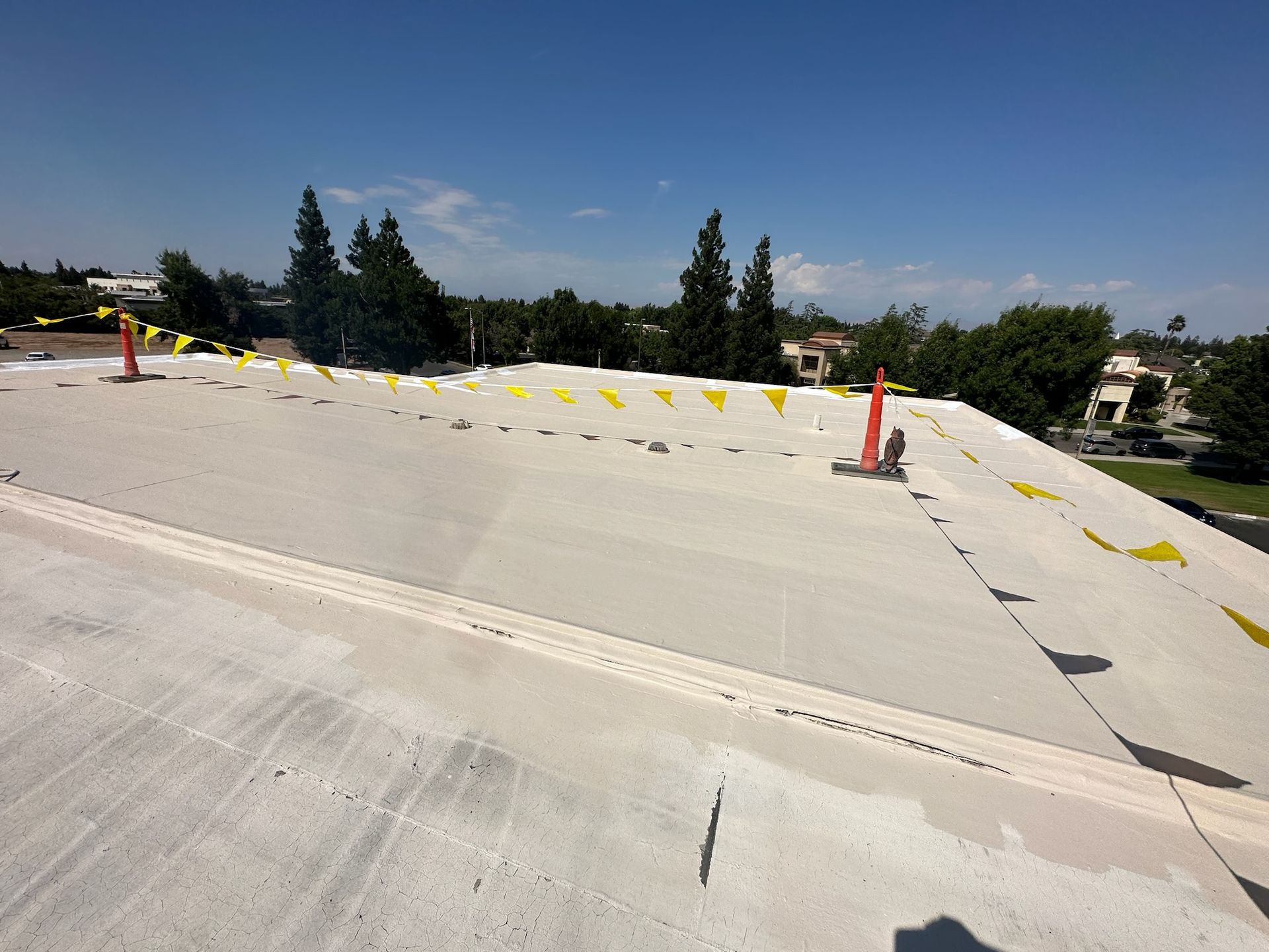 A roof with a lot of yellow flags on it