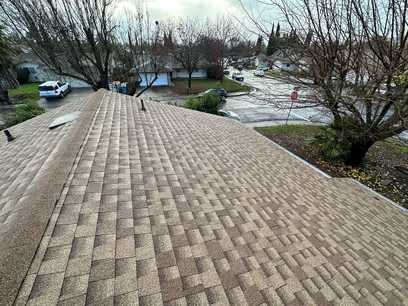 A close up of a roof with a lot of shingles on it.