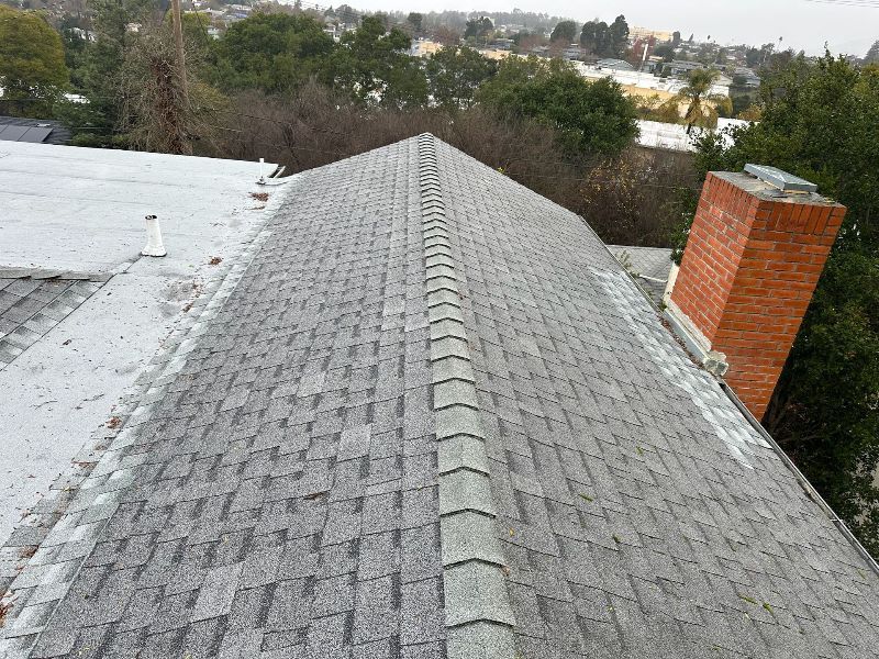The roof of a house is being remodeled and the roof is covered in plywood.