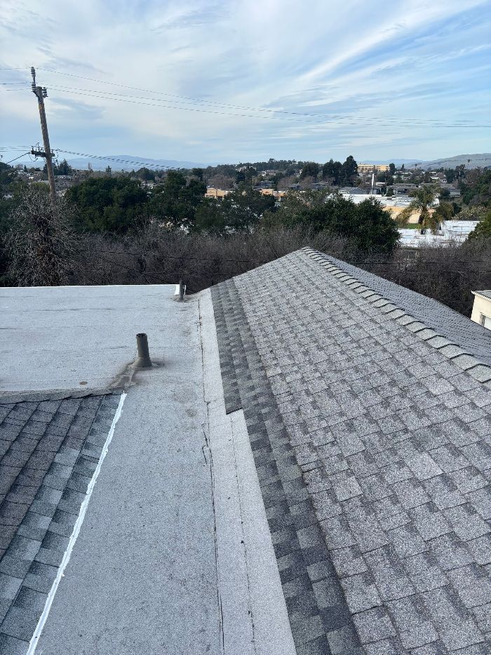 A close up of a roof with a lot of shingles on it.
