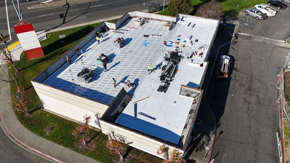 An aerial view of damaged roof shingles.