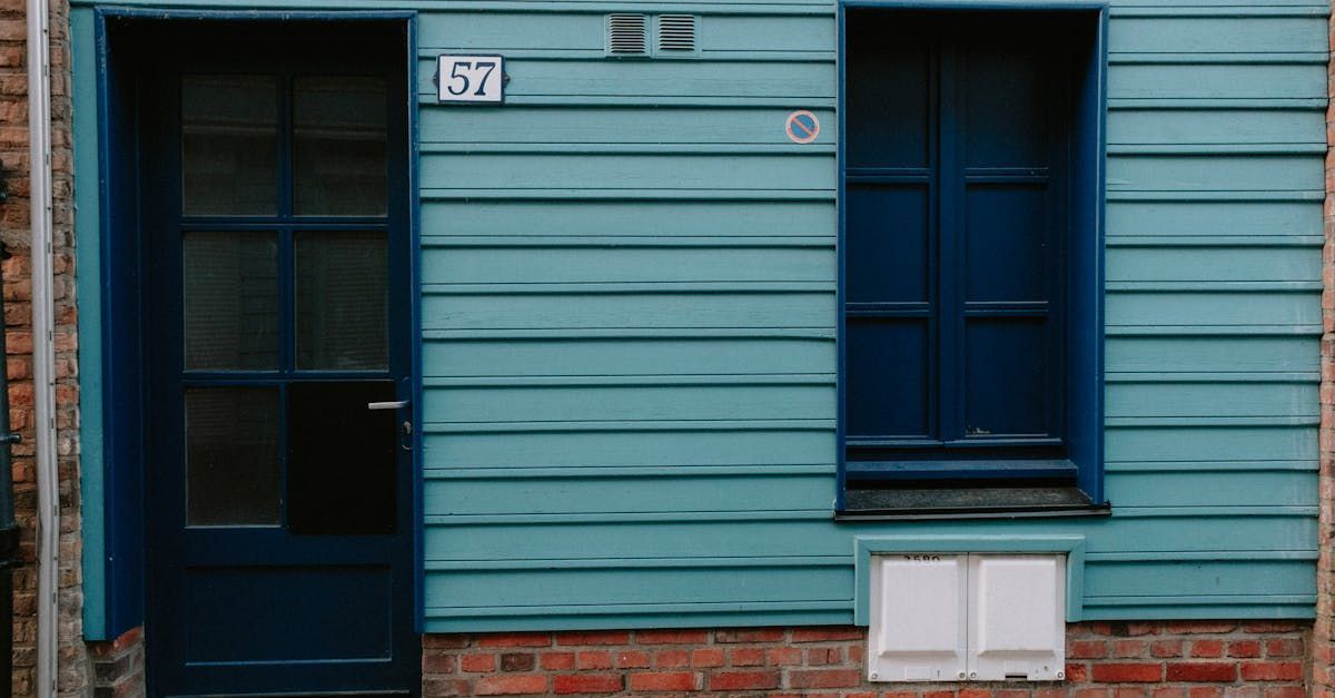 A blue house with a blue door and a blue window.