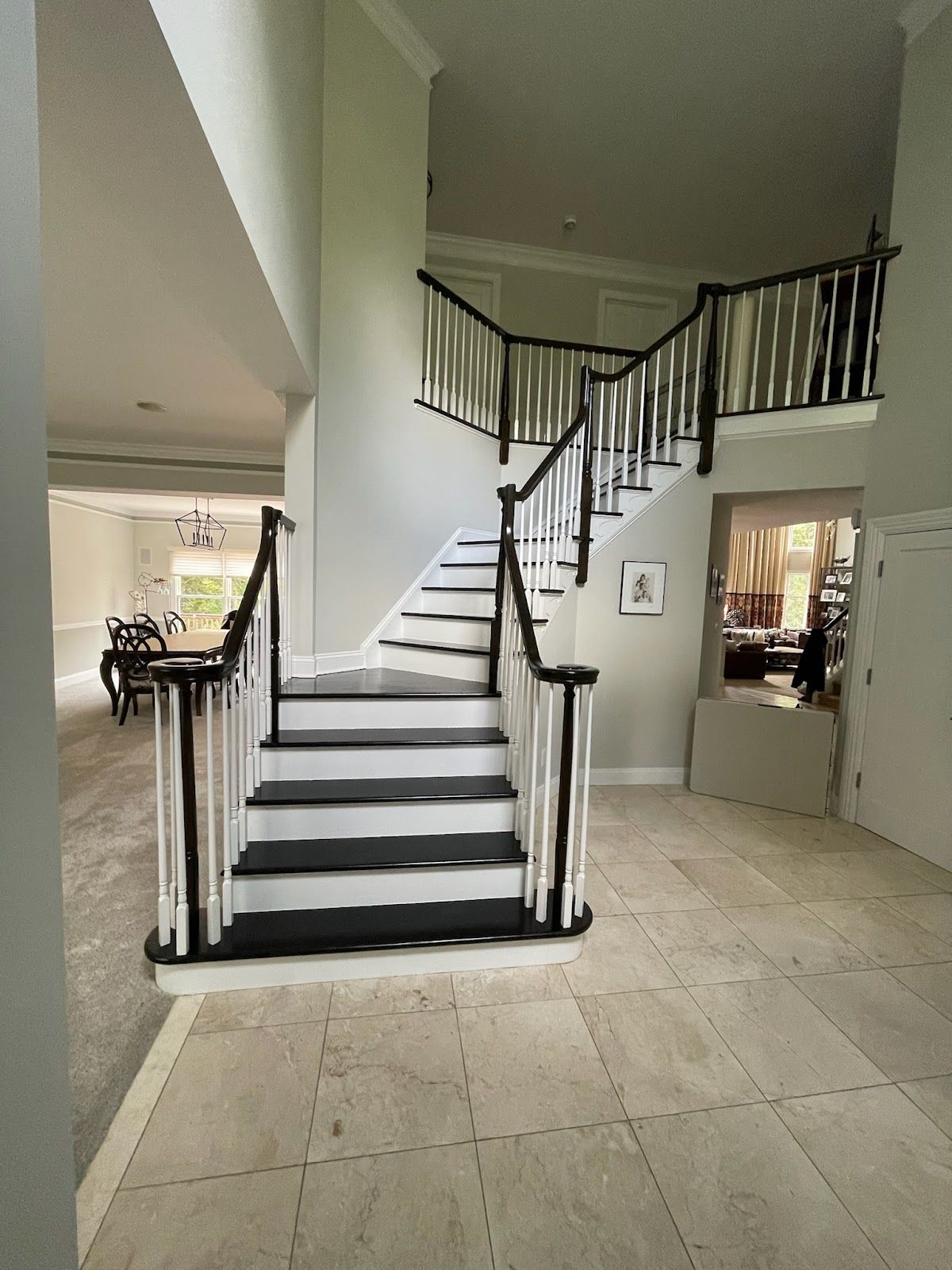 A staircase with white steps and a wooden railing