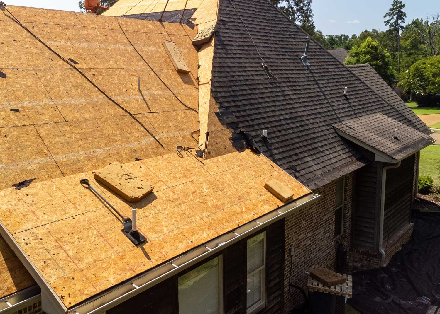 A house with a roof that is being repaired.