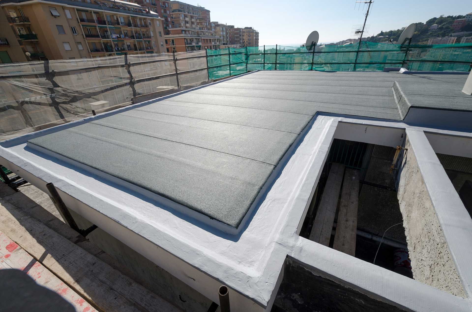 A roof that is being built with a satellite dish in the background