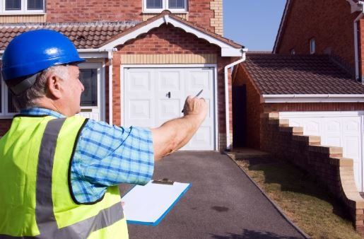 Surveyor checking for defects