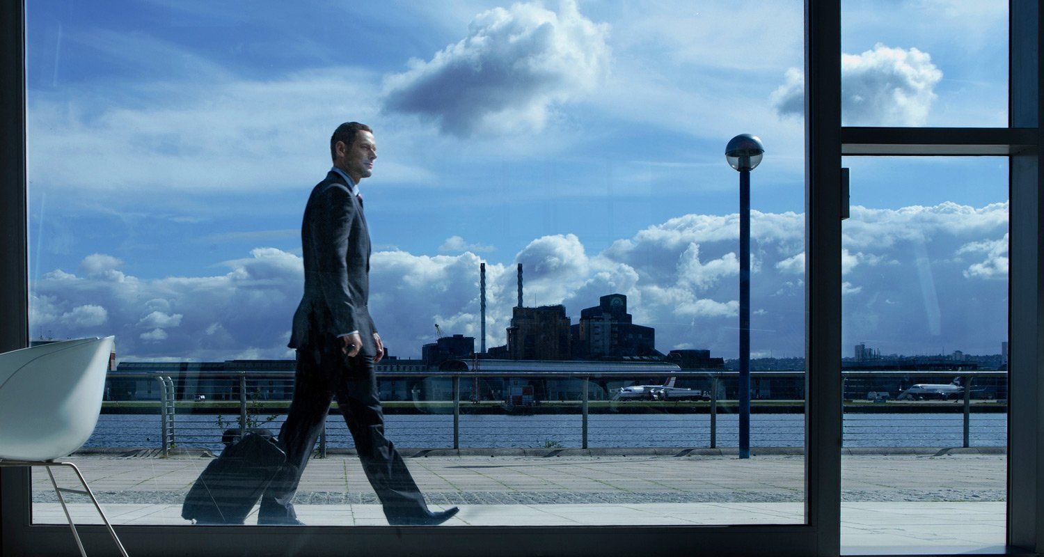 Man walking past a window