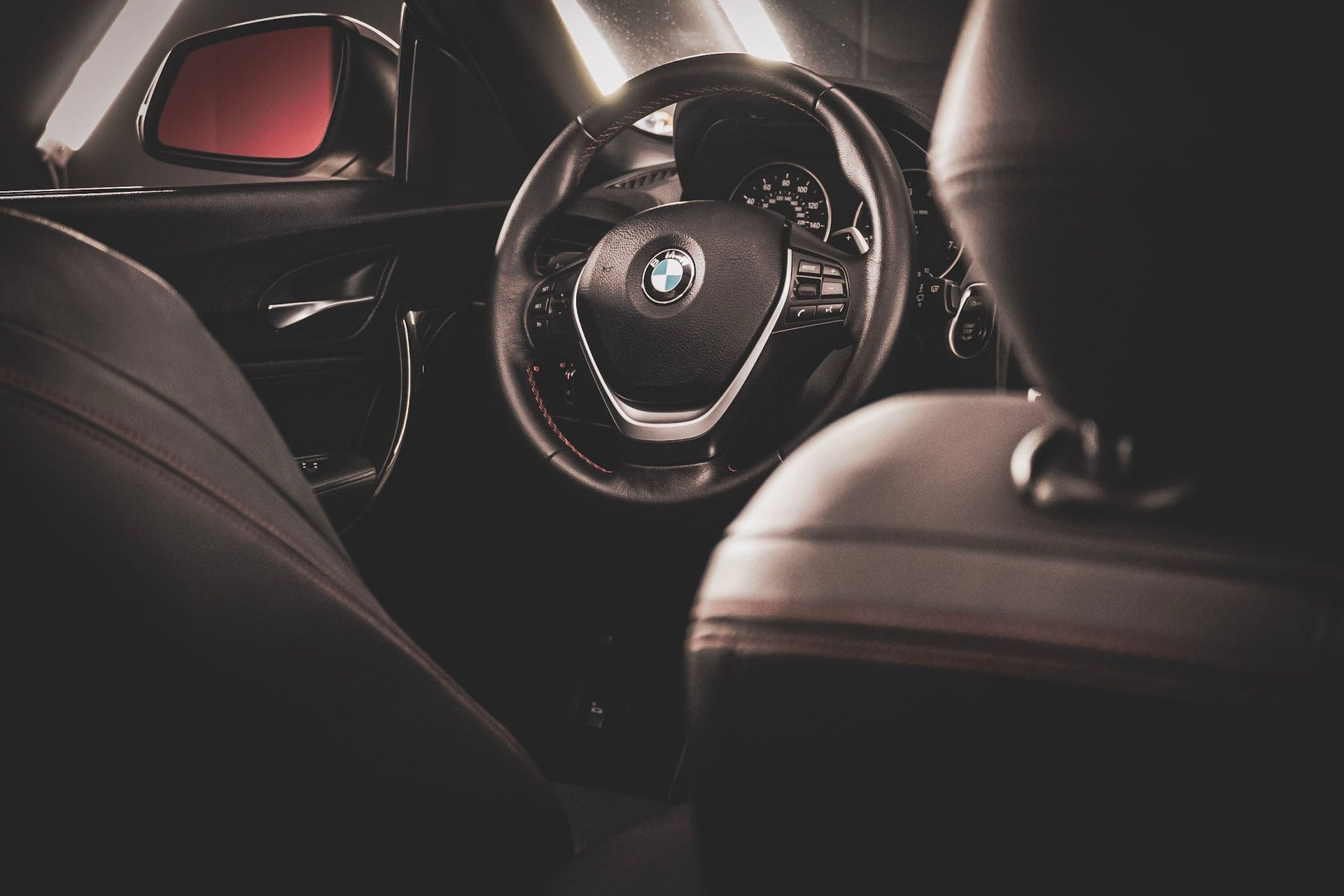 Close-up interior photography of a luxury car steering wheel and dashboard – Shine Again Photography in Newnan, GA