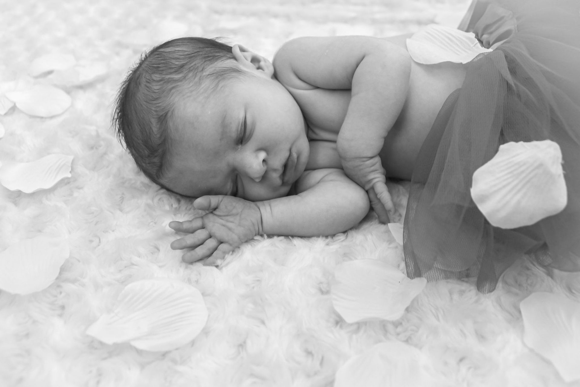 Sleeping newborn swaddled on flower petals – Shine Again Photography Newnan GA