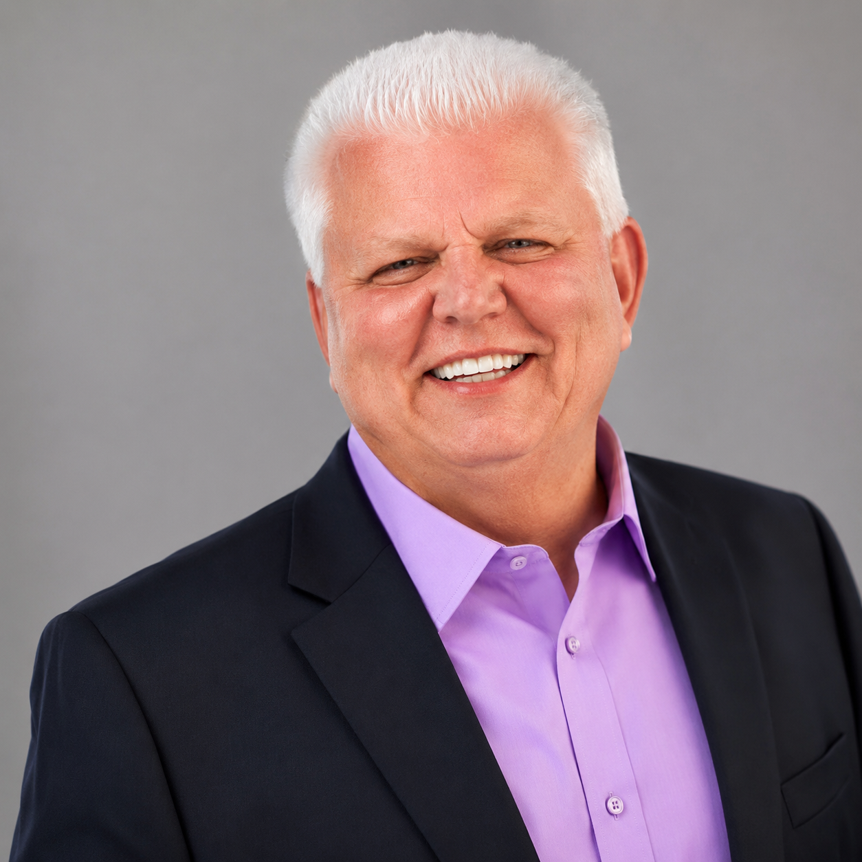 Professional headshot of a smiling local pastor in a suit - Shine Again Photography headshots in Newnan GA