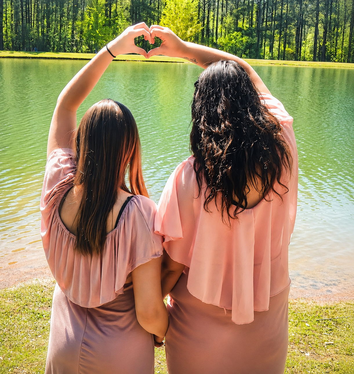 Two best friends making a heart hands pose over a lake – Shine Again Photography Newnan GA