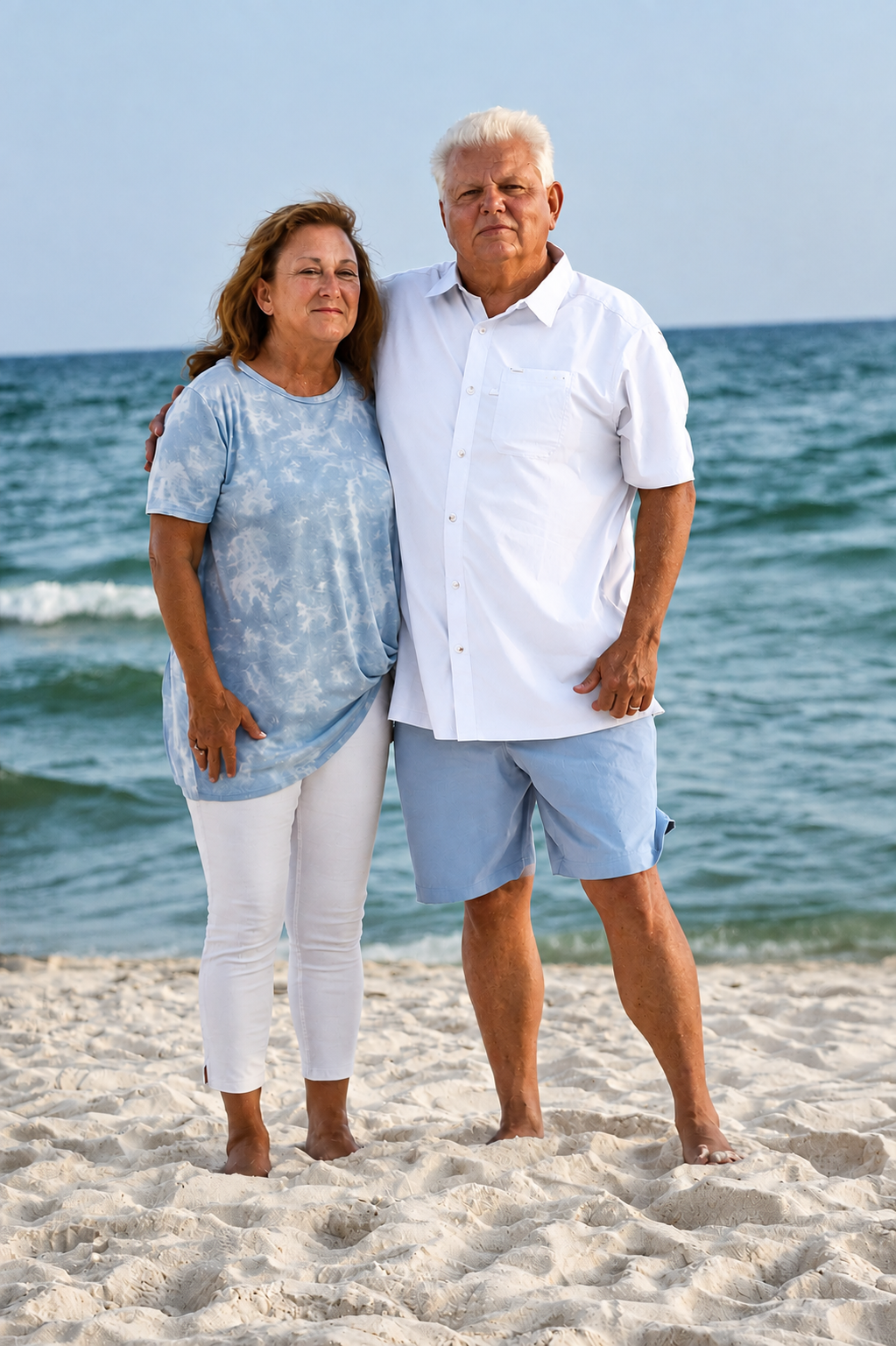 Couple posing together on the beach for an engagement photography session in Newnan, GA.