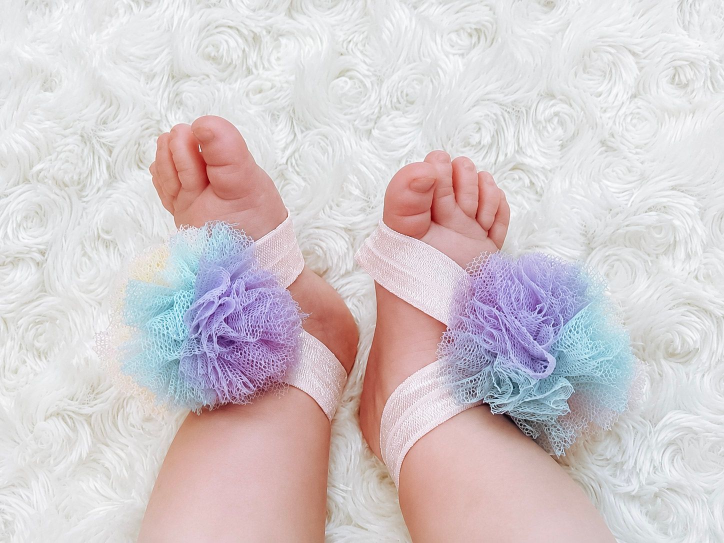 Newborn baby feet with pastel ruffle anklets on soft blanket – Shine Again Photography Newnan GA
